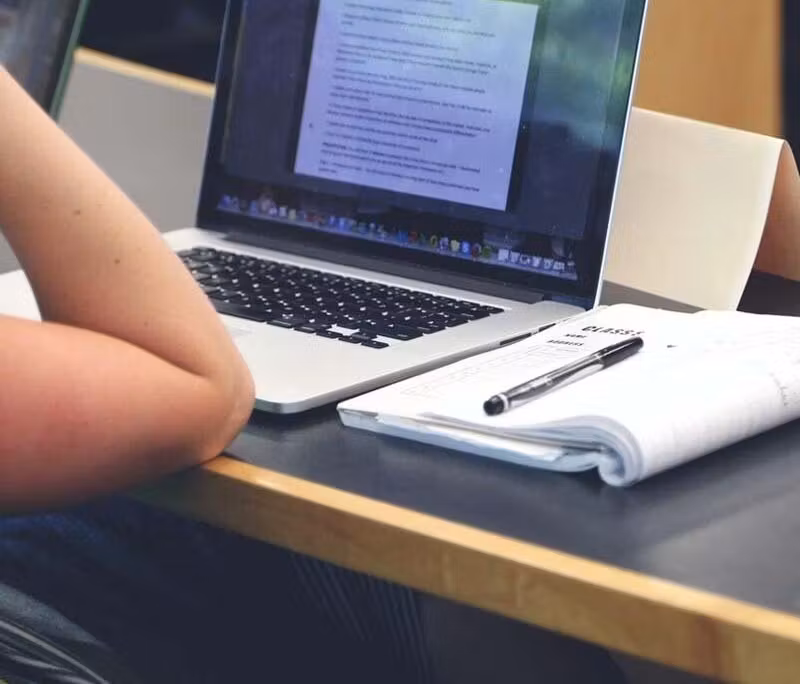 students with computer - clever ways students cheat in online exams - digify